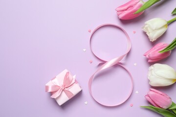 8 March, International Women's Day. Figure eight made of pink ribbon with beautiful tulips and gift box on a color background. Space for text