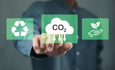 Reduce co2 emission. man using software to lower CO2 emissions to limit global warming and climate change,