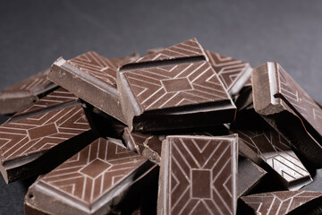 broken chocolate bar chips, parts or pieces pile