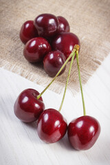 Fresh ripe cherries on jute cloth. Healthy dessert or snack