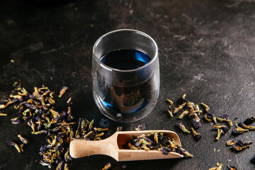 Tibetan Anchan tea on a dark background close-up. Blue tea