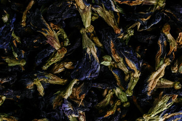 Tibetan Anchan tea on a dark background close-up. Blue tea