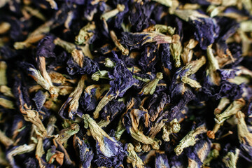 Tibetan Anchan tea on a dark background close-up. Blue tea