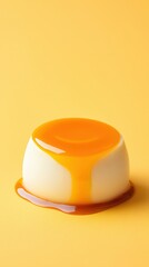 Small white plate with yellow sauce and egg caramel flan realistic food photography