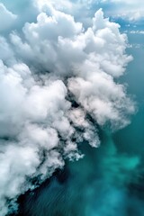 Puffy white clouds drifting over a turquoise ocean, casting shadows on the water,