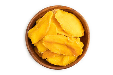 Dried Mango in wooden bowl isolated on white on brown wooden. Top view, close up