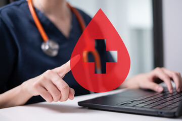 Professional health care worker doctor physician holding blood icon for blood donation concept