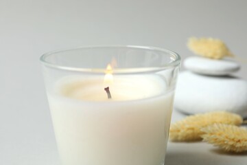 Beautiful candle on gray background 