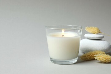 Beautiful candle on gray background 