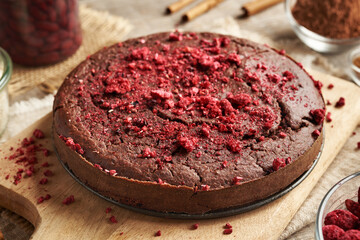 Homemade gluten-free brownie made with red kidney beans, oat flakes, chocolate and freeze-dried berries