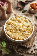 Fermented cabbage or sauerkraut in a white bowl