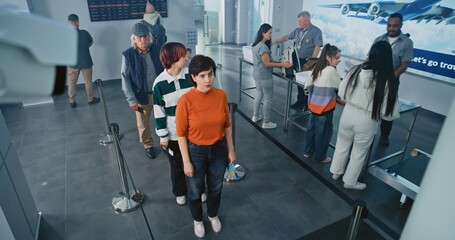 Security Checkpoint in Airport Terminal: Queue of Diverse People, Tourists on TSA Screening...