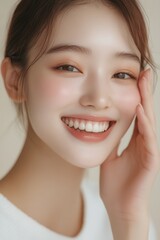 Smiling young woman with natural makeup and healthy skin, expressing joy and confidence, suitable for wellness, beauty or lifestyle related projects.