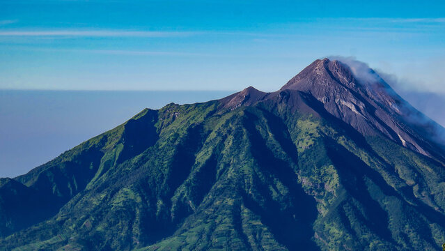 Mount Merapi is the most active volcano in Indonesia, located in Central Java. Photo taken from the Mount Merbabu hiking trail.