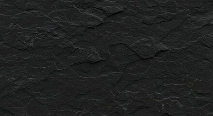 Deep black slate rock shows many rugged textures patterns