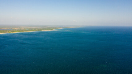 The sea coast of the island of Sri Lanka with a sandy beach. Nilaveli Beach, Trincomalee.
