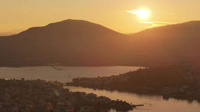 A sunset scene in Chalkida with the old Evripus Bridge in the background