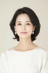 Elegant Portrait of a Woman with Delicate Jewelry and Soft Pink Dress