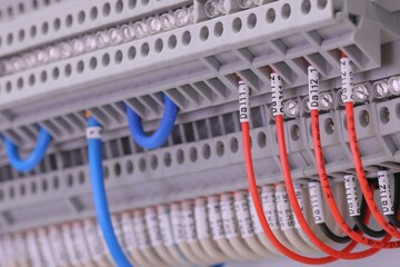Connection of electrical modules using insulated copper electrical wires. Close-up. Soft focus.