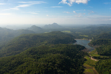 Aerial view of mountains covered with forest and jungle in the morning haze. Sri Lanka.