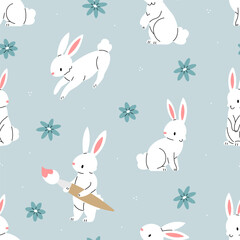 Fototapeta premium Seamless pattern with white bunnies and flowers on a blue background. Vector Easter illustration background. Flat illustration.