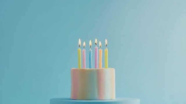 A simple birthday cake with colorful candles against a blue background, in a minimalist style