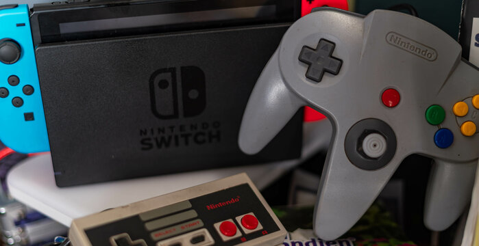 Nintendo Old school controllers, selective focus gaming background image, new generation with old dusty console controllers, authentic gaming background image