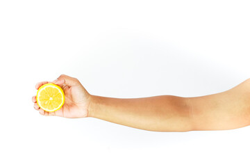 Holding a sliced lemon on white, sour yellow fruit, citrus and human