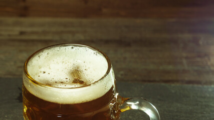Glass goblet with fresh beer and foam