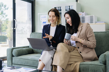 Diverse professionals collaborate on project data analysis, and teamwork in modern office.
