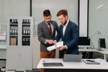 Diverse Business Team Discusses Financial Project Analysis in Meeting.