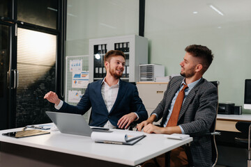 Male businessman is doing a stretchy posture due to sitting in the office for too long, office syndrome concept.