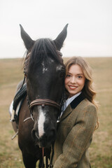 Young Woman Embracing a Horse Outdoors in a Rural Field Setting