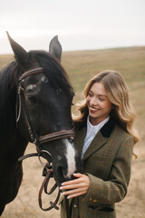 Fototapeta premium Smiling Woman Bonding With Horse in Open Countryside Setting