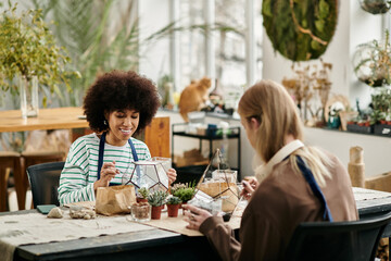 Creating unique plant art together at a vibrant workshop filled with friendship and succulents