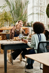 Creating vibrant succulent arrangements together in a lively workshop of friendship