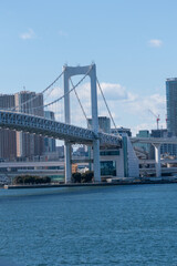 Fototapeta premium Rainbow bridge close up under the blue sky in Tokyo, Japan