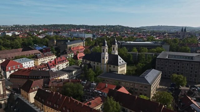 Aerial drone view of St. Stephan's Church in W&uuml;rzburg, Germany, highlighting its stunning architecture and surrounding cityscape. 