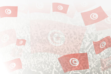 Celebratory Crowd with Tunisia Flags Background
