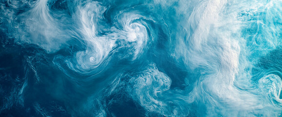 Naklejka premium Swirling ocean water with foam and waves, creating an abstract dynamic pattern in shades of blue and white. This image evokes a sense of fluidity and natural movement.