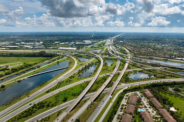 American highway multilevel road junction in Miami urban populated area. Wide freeway crossroads in...