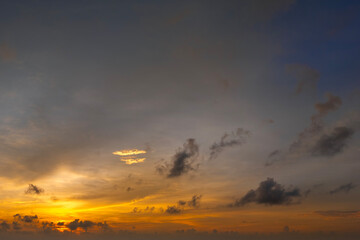 Beautiful sunset sky scenery. Bright colorful orange and yellow clouds on horizon
