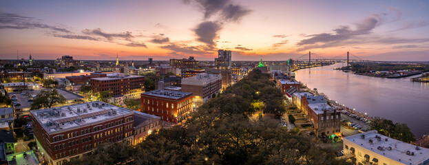 Savannah, Georgia. Old historic River Street architecture. View from above of illuminated streets...