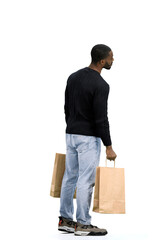 A man, full-length, on a white background, with bags