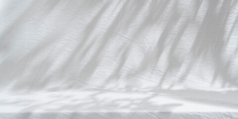 Table on bright brown wall background. Composition with tree shadow on the wall. Background for presentation, branding products, cosmetics, food or jewellery.	