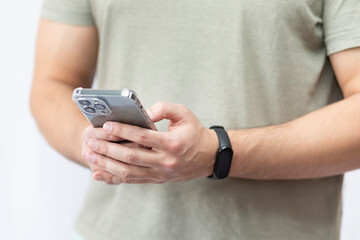Close-up shot of man with smart band using smartphone isolated on white background