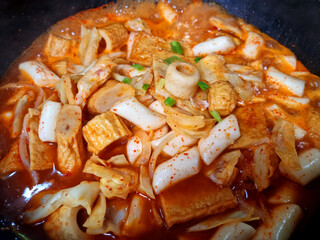 This is Korean style tteokbokki being boiled in a pot.