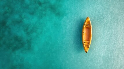 This captivating image features a single yellow kayak gently floating on tranquil turquoise waters, highlighting the beauty of nature and peaceful outdoor activities.