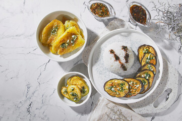 Delicious, fried eggplants with rice and soy sauce. Vitamin food. Vegetarian dish.