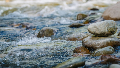 Smooth stones in clear blue water.